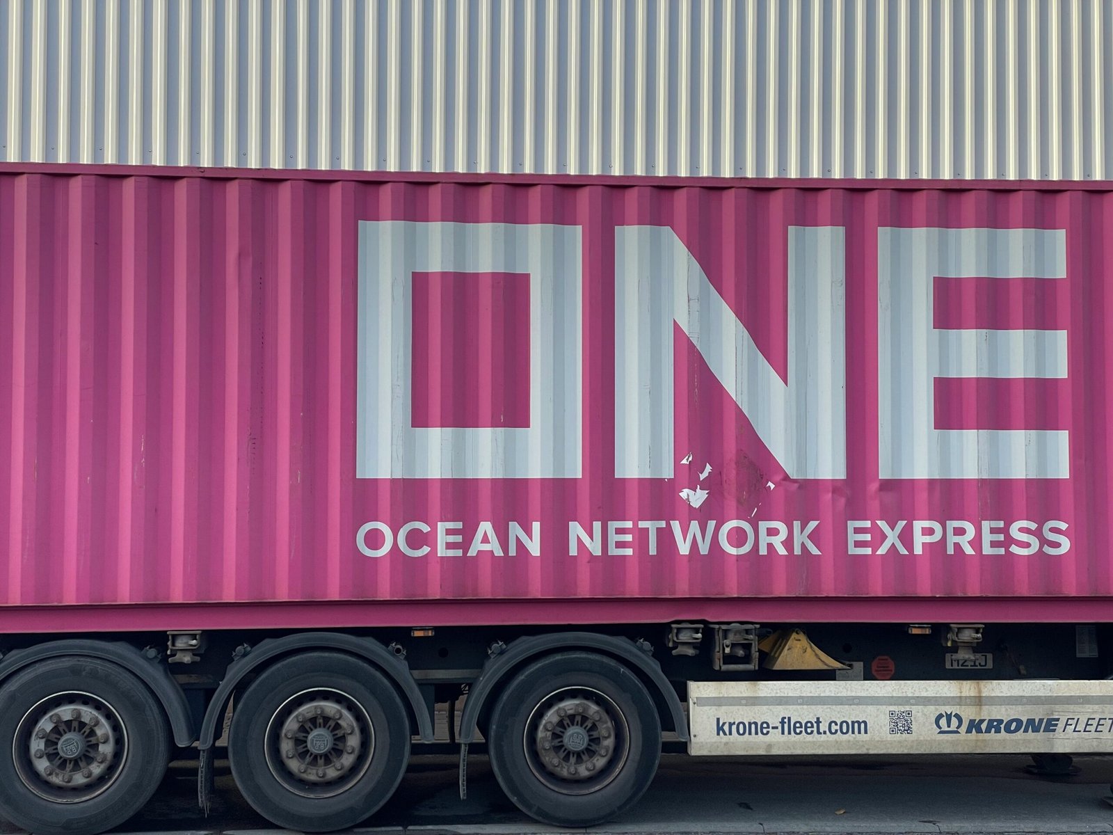 a pink truck with the word ocean network express painted on it